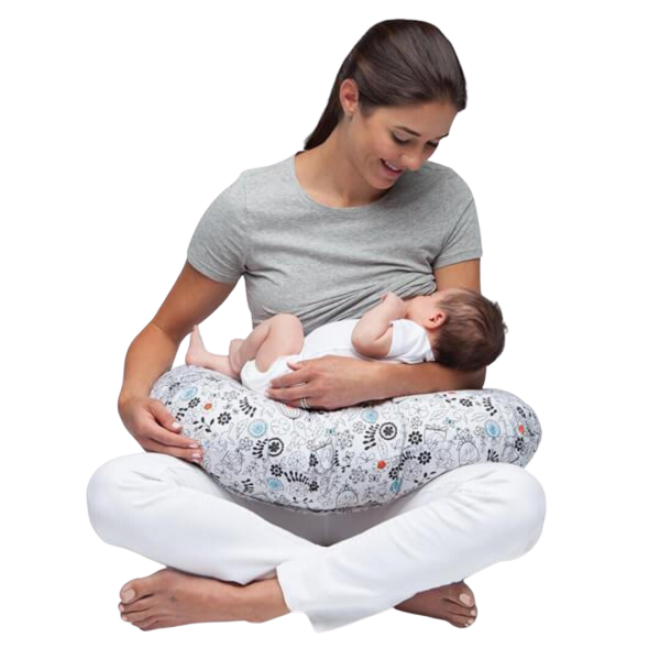 a woman feeding a baby and using DeepSleep Nursing Pillow